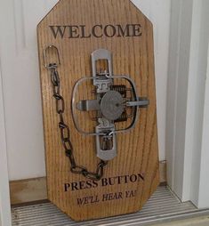 a wooden sign that says welcome to press button we'll hear ya on it