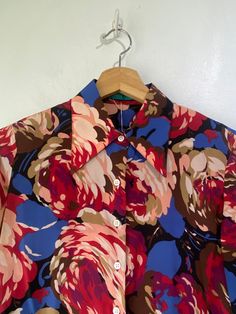 Vintage Cacharel Floral Silk Blouse! So cute! Long sleeves, a classic collar, and buttons up the front. Would best fit a size small, please refer to measurements. In overall great vintage condition with minor signs of wear on the arm pits. Approx. Measurements: Underarm to Underarm: 19" Sleeve Length: 24.5" Length: 23.5" Retro Collared Blouse For Work, Retro Workwear Blouse With Peter Pan Collar, Retro Peter Pan Collar Blouse For Work, Fitted Vintage Print Collared Blouse, Vintage Multicolor Blouse For Daywear, Fitted Collared Blouse With Vintage Print, Vintage Style Multicolor Blouse For Daywear, Vintage Blouse With Button Cuffs For Work, Vintage Workwear Blouse With Button Cuffs