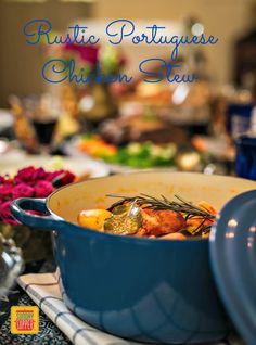 a blue pot filled with food sitting on top of a table next to other dishes