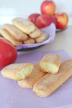 there are some cookies and apples on the table