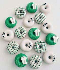 green and white donuts with designs on them