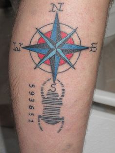 a man with a compass tattoo on his leg