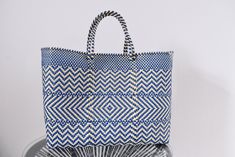 Large Bag 45*35*14 cm Mexican bag handwoven with recycled plastic - Beautiful Beach Bag - Market bag - We handle Wholesale The best option is always to use hand-woven bags with recycled plastic, this way you will support the environment and all the people who carry out this noble, unique and arduous task that is Mexican Crafts. Follow us on our social networks and share! You will surely love to discover more incredible pieces from our majestic and unique Mexico www.facebook.com/holasenorita www.pinterest.com.mx/hola_senorita www.instagram.com/hola_senorita_mx Enter our website and find all our pieces for immediate shipping; Remember that we have more pieces, so we can also make pieces with requested designs and colors. +Estimated delivery time+ North America: 3-4 weeks Europe: 3-5 weeks As Rectangular Recyclable Beach Bag For Vacation, Eco-friendly Beach Bags With Reinforced Handles, White Recyclable Beach Bag For Shopping, Recyclable Rectangular Beach Bag For Shopping, Eco-friendly Blue Bags Made From Recycled Plastic, Eco-friendly Blue Bags Made From Recycled Plastic Bottles, Vacation Bags Made From Recycled Plastic Bottles, Recyclable Vacation Bags Made From Recycled Plastic, Eco-friendly Tote Bag For Shopping