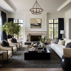 a living room with couches, chairs and a coffee table in front of a fireplace