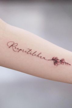 a woman's arm with a tattoo on it that says, reptilen