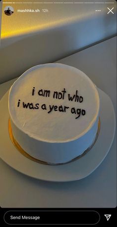 a white cake with black writing on it