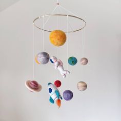 an image of a mobile with planets hanging from it