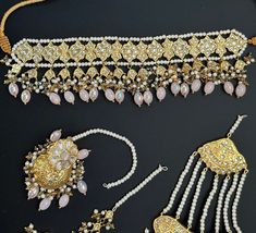 This lightweight and dainty set in thapa kundan or multani work is made of high quality gold plating and has gorgeous pink crystal drops that have an ombre finish. The colors are super unique and pastel so that they can go with any outfit whether its a saree or lehenga! and can be worn separately for a simple look. This lightweight and elegant necklace is perfect for any bridesmaid, bride, sangeet or any occasion or event as a gift for any occasion as any one who loves jewelry will love this sta Elegant Pink Kundan Jewelry Sets, Elegant Pink Kundan Sets, Pink Kundan Sets With Cutdana, Pink Bridal Necklace With Tilla, Pink Tilla Bridal Necklace, Elegant Pink Kundan Necklace, Hand Set, Pink Elegant Kundan Necklace For Diwali, Elegant Pink Hand-set Kundan Necklace, Elegant Pink Kundan Necklace For Diwali