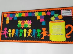 a bulletin board with children's silhouettes on it