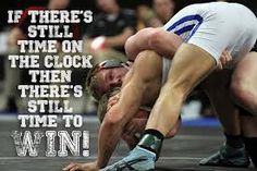 a wrestling match with the words if there's still time on the clock, then there's still time to win