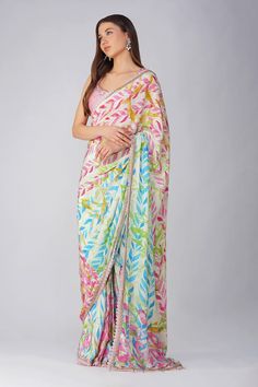 Pink and multi color pre-stitched saree with all over leaf print, attached draped pallu, pleated details, scalloped gota and lace border details. Comes with pink padded blouse with scattered sequin work. - Aza Fashions Festive Multicolor Unstitched Pre-draped Saree, Designer Multicolor Pre-draped Saree, Bollywood Style Multicolor Pre-draped Saree For Navratri, Bollywood Multicolor Pre-draped Saree For Navratri, Multicolor Georgette Dress For Diwali, Festive Multicolor Pre-draped Saree With Floral Print, Multicolor Silk Pre-draped Saree With Zari Work, Multicolor Georgette Saree Dress, Multicolor Silk Saree Set