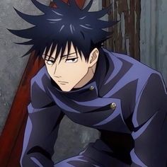 an anime character with black hair and blue eyes sitting in front of a wooden wall