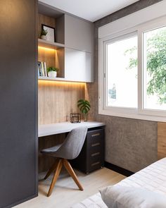 a bedroom with a bed, desk and bookcase in the corner next to a window