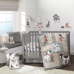 a baby's room with white walls and gray furniture