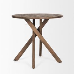 a wooden table with two crossed legs and a round top, against a white background