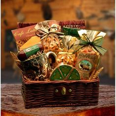 a basket filled with lots of different types of food and snacks on top of a wooden table