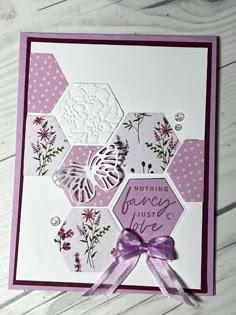 a close up of a greeting card with flowers and butterflies on it, featuring the words nothing fancy just love