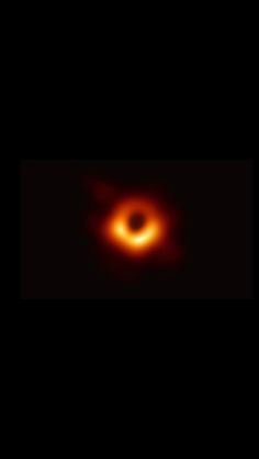 a black hole in the sky with a red ring on it's side and an orange light at the top