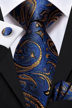 Treat yourself with a new pattern and splash of color to your look with this unique tie set. 100% Silk Handmade Package Includes: Tie, Pocket Square & Cufflinks. Length: 59" Width: 3.34" Warm iron if needed We offer FREE International Shipping World Wide! Blue And Gold Suits For Men, Navy And Gold Suit, Blue Elegant Suit And Tie Accessories For Formal Occasions, Elegant Blue Tie For Business, Elegant Blue Ties, Luxury Blue Ties For Business, Elegant Blue Office Ties, Elegant Navy Suit And Tie Accessories For Wedding, Elegant Blue Suit And Tie Accessories For Office