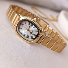 💎 Product Specifications: ➡ Case Diameter: 20mm ➡ Material: Stainless stell ➡ Color: Gold ➡ Dial Shape: Oval ➡ Adjustable Band: Yes ➡ Strap Type: Adjustable Metal Band ➡ Movement: Quartz ✈Free shipping Searching for a truly exceptional gift for that special woman in your life? Look no further than this exquisite wristwatch, a stunning piece that effortlessly merges classic vintage design with contemporary elegance. Crafted in a captivating gold color, it exudes luxury and refinement, making it Vintage Gold Watch, Present For Her, Quartz Colors, Watch For Women, Presents For Her, Roman Numeral, White Band, Gold Colour, Gold Case