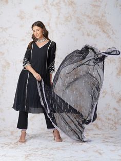 Our best selling A-line kurta style is emebllished with beads, thread and crystals. Paired with sequinned dupatta and elasticated waist glace cotton pants detailed with laces. It comes with a rayon slip linning. Black Fabric: Chanderi, Georgette and Galce Cotton Note: Wash Care - Dry Clean only The product will be delivered within 3-4 weeks of order placed Relaxed Fit Zardozi Work, Black Poppy, Kurta Set For Women, Kurta Style, Kurta Dress, A Line Kurta, Elegant Embroidery, Ethnic Outfits, Elegant Saree