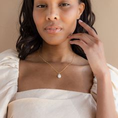 Gift your bridesmaids something they can wear every day and any day. The pearl pendant on a dainty station chain is elegant and delicate, everything you want in a beautiful bridal or bridesmaid jewelry piece. Material: High Quality Solid 925 Sterling Silver, Freshwater Pearl Finish: Sterling Silver ∙ 18K Gold Featuring ~12mm Pearl pendant with an adjustable 16 to 18 inch Station style chain. Model is wearing the 18 inch length in the first listing image SKU: RR-NR076 Bridesmaid Gift Necklace With Pearl Charm, Refined Wedding Necklaces With Pearl Charm, Pearl Pendant Jewelry For Bridesmaid Gift, Refined Pearl Chain Wedding Jewelry, Refined Wedding Necklace With Pearl Charm, Refined Pearl White Wedding Necklace, Pearl Charm Jewelry For Bridesmaid Gift, Feminine Pearl Necklace With Delicate Chain For Wedding, Elegant Jewelry With Delicate Pear-shaped Chain