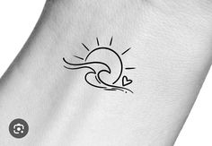 a small sun and wave tattoo on the back of a woman's left arm