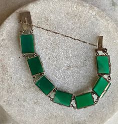 Art Deco Green Chrysoprase Sterling Siliver Vintage Antique Bracelet The bracelet measures 7 inches long See matching necklace in link below https://www.etsy.com/listing/897112044/art-deco-green-chrysoprase-sterling?ref=shop_home_active_1&frs=1 Green Jewelry With Extender As Gift, Antique Green Handmade Bracelet, Handmade Antique Green Bracelet, Green Art Deco Bracelets As A Gift, Green Art Deco Bracelets As Gift, Green Art Deco Bracelets For Gift, Green Art Deco Bracelet As Gift, Green Art Deco Bracelet, Antique Green Rectangular Jewelry