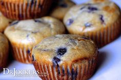 several blueberry muffins on a white plate