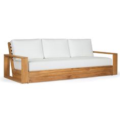 a wooden couch with white cushions on it