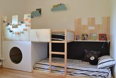 a child's bedroom with bunk beds and toys