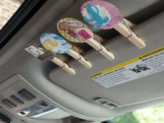 the interior of a car with three wooden pegs attached to it's ceiling