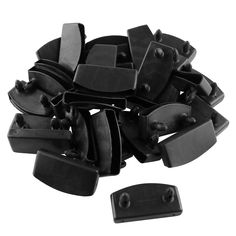 a pile of black plastic clips on top of each other