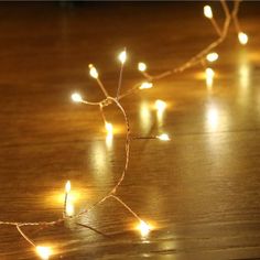 a string of lights on a wooden table