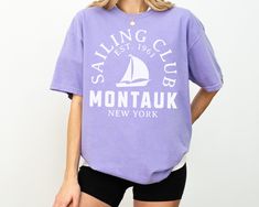 Sail into style with our Montauk Sailing Club Comfort Colors Short Sleeve T-Shirt. This tee embodies vintage retro sailing vibes, perfect for sailing enthusiasts and lovers of classic nautical fashion. Crafted from soft, durable Comfort Colors cotton, it offers a relaxed fit and timeless appeal. Embrace the spirit of Montauk's sailing heritage with this stylish and comfortable t-shirt. Size up 1-2 sizes for oversized fit! Comfort Colors® Unisex T-Shirt * * * * * * * * * * * * * * * * * * * * * * Hamptons New York, New York Shirt, Nautical Fashion, Yacht Club, Inspired Outfits, Color Shorts, Comfort Colors, San Jose, Clothing Items