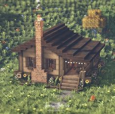 a small house in the middle of a lush green field with flowers and trees around it