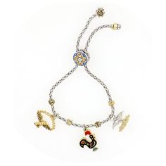 Portuguese Collection Adjustable Bolo Bracelet with Charms by John Medeiros Jewelry Collections. John has brought his heritage to life in this beautiful collection of necklaces, bracelets and charms literally symbolizing historical images of Portugal. From the colorful tiles to the Galo de Barcelos and everything in between. Bracelet bolo tie has a red side and blue side for versatility. Includes Rooster, Eagle & Two Tone Whale Tale Whale Tale, Colorful Tiles, Bracelet With Charms, Bolo Bracelet, Colourful Tile, Historical Images, Necklaces Bracelets, Rooster, Two Tone