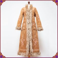 The ultimate vintage 70s style vegan afghan coat with the the most beautiful embroidery ♡  Really an iconic must have staple for any wardrobe. Definitely much more stunning in person!! PICTURES DO NOT DO IT JUSTICE... Size M ⫸ Absolutely amazing timeless design ⫸ ✿100 VEGAN✿ ⫸ 100% AUTHENTIC vintage piece ⫸ Condition: Beuatiful overall vintage condition!! No major flaws. Normal signs of wear. Without any       odors. Please see the pictures ❀ ♡ Don't, hesitate to contact me if you would like to 70s Afghan Coat, Fitted Bohemian Outerwear For Winter, Hippie Long Fall Outerwear, Hippie Brown Outerwear For Fall, Bohemian Brown Long Coat, Fitted Long Bohemian Outerwear, Folk Style Brown Outerwear For Fall, Hippie Brown Outerwear For Festivals, Vintage Long Embroidered Outerwear