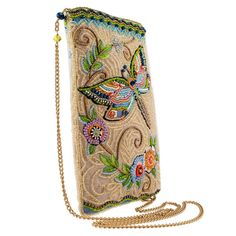 an embroidered purse with a chain attached to the front and side, on a white background