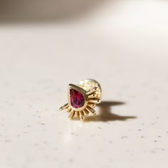 The Borderline stud piercing you are currently reviewing is entirely handmade. All components are crafted using 14-karat gold. The stone is Rhodolite. This is a custom-made piece and is made to order. Rhodolite is known as a Stone of Inspiration, bringing the inspiration of love via the heart and mind. It helps one receive abundance on an emotional level, stimulating one's sense of self-worth and alleviating feelings of inadequacy. It assists in owning one's gifts and abilities, and sharing them with others. (Blue stone is London Blue Topaz, yellow stone is Citrine. They are also listed in my shop.) I'm able to replace Rhodolite with precious stones (diamond, sapphire, ruby, and emerald) or semi-precious stones such as London Blue Topaz, Citrine, Peridot, Tourmaline, Tanzanite, Amethyst, S Anti Tragus, Back Piercings, Labret Piercing, Gold Flats, Tragus Earrings, Gold Alloys, Yellow Stone, Helix Piercing, Gold Bar