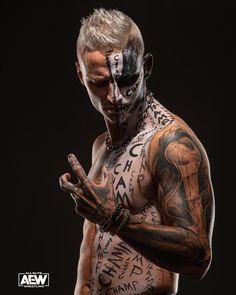 a man with tattoos on his body and hands