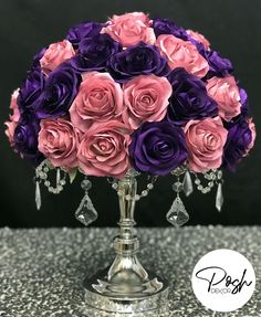 purple and pink flowers in a silver vase