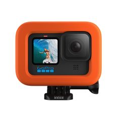 an orange gopro action camera with the screen showing a woman surfing in the ocean