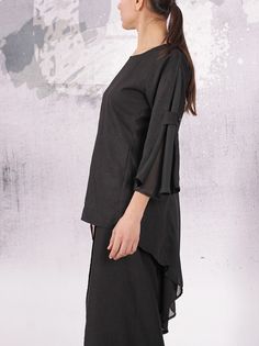 "Black linen blouse with chiffon 7/8 sleeves and chiffon back. I can make the coat according to your size. I DO NOT CHARGE extra money for custom order. Material - linen, chiffon The model on the picture is size S. Can be made in ALL SIZES. Enjoy this coat and always be in a good mood! ALL GARMENTS IN THIS SHOP ARE MADE ACCORDING TO YOUR MEASUREMENTS. PLEASE GIVE YOUR SIZE (MEASUREMENTS) IN THE ETSY NOTE TO SELLER SECTION DURING THE TRANSACTION. For your convenience look at the table below for s Wide Sleeve Top, Asymmetric Tunic, Maternity Tunic, White Linen Dresses, Linen Collection, Turquoise Dress, Sleeves Top, Linen Blouse, House Dress