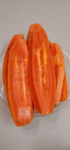 two slices of tomato on a clear plate