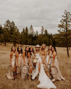 a group of women standing next to each other in a field