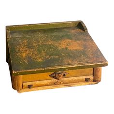 an old wooden box with rusted paint on the top and bottom, sitting in front of a white background