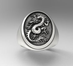 - Dragon Silver Ring - Simple and impressive black style accessory - A special piece for the treasure - High quality materials and attention to detail The engraving details of the 925 sterling silver handmade ring are extremely detailed and eye-catching. - The ring is plated with oxide to highlight the details of the handmade engraving. - Material: 925K Silver - Total weight: 13-16 Grams (Depends on size) - Ellipse Frame Diameter: 20x15 mm It is sent to all of Turkey within 1-4 working days with Animal Ring, Silver Rings Simple, Dragon Ring, Dragon Jewelry, Silver Signet Ring, Animal Rings, Ring Ideas, Unisex Ring, Gift Ring