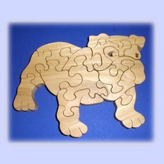 the wooden puzzle is shaped like a bear