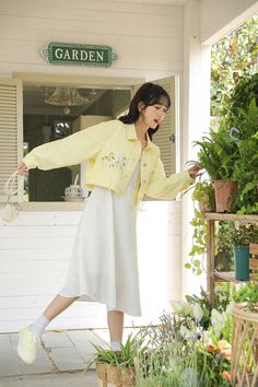 Cropped light yellow jacket with growing wildflower embroidery and belt loops. S: 15" across shoulders, 39" chest, 19" lengthM: 15.5" across shoulders, 40.5" chest, 19" lengthL: 16" across shoulders, 42" chest, 19.5" length Wildflower Embroidery, Grow Wildflowers, Yellow Jacket, Shoe Gifts, Cropped Jacket, Overall Dress, Sweater Blouse, Cardigan Jacket, Light Yellow